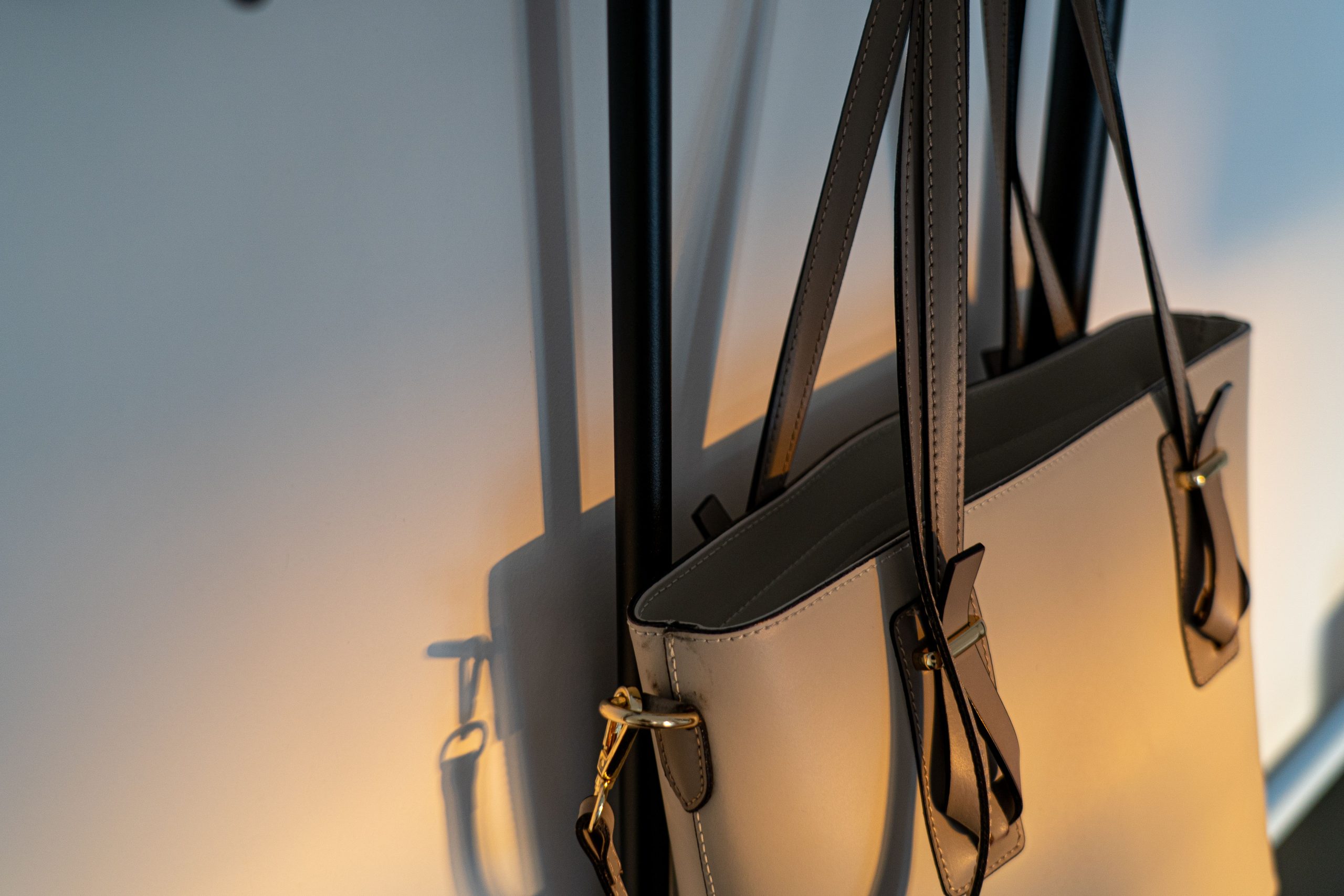 leather tote handbag with elegant handles and gold-tone hardware.