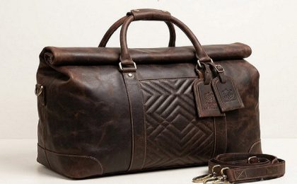 Brown genuine leather travel duffel bag with handles and detachable shoulder strapBrown genuine leather travel duffel bag with handles and detachable shoulder strap